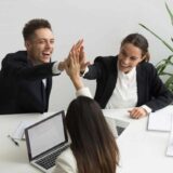 excited millennial office team giving high five together teambuilding concept 1280x853 1