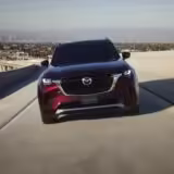 RS64067 CX 90 US LHD C006 High EXT StraightFront ArtisanRed H3T
